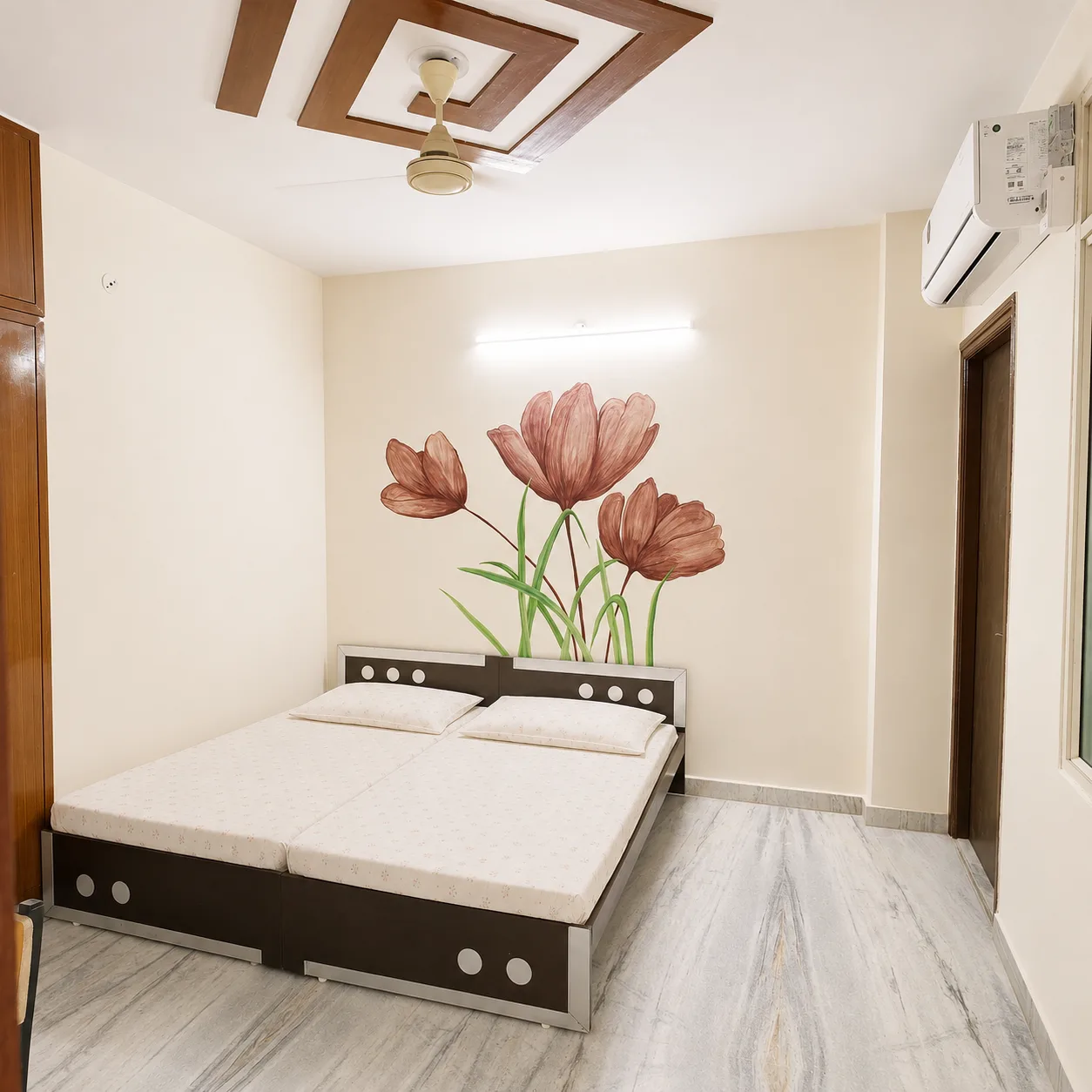 Furnished air-conditioned room with bed, wardrobe and study space at Narayani Girls Hostel